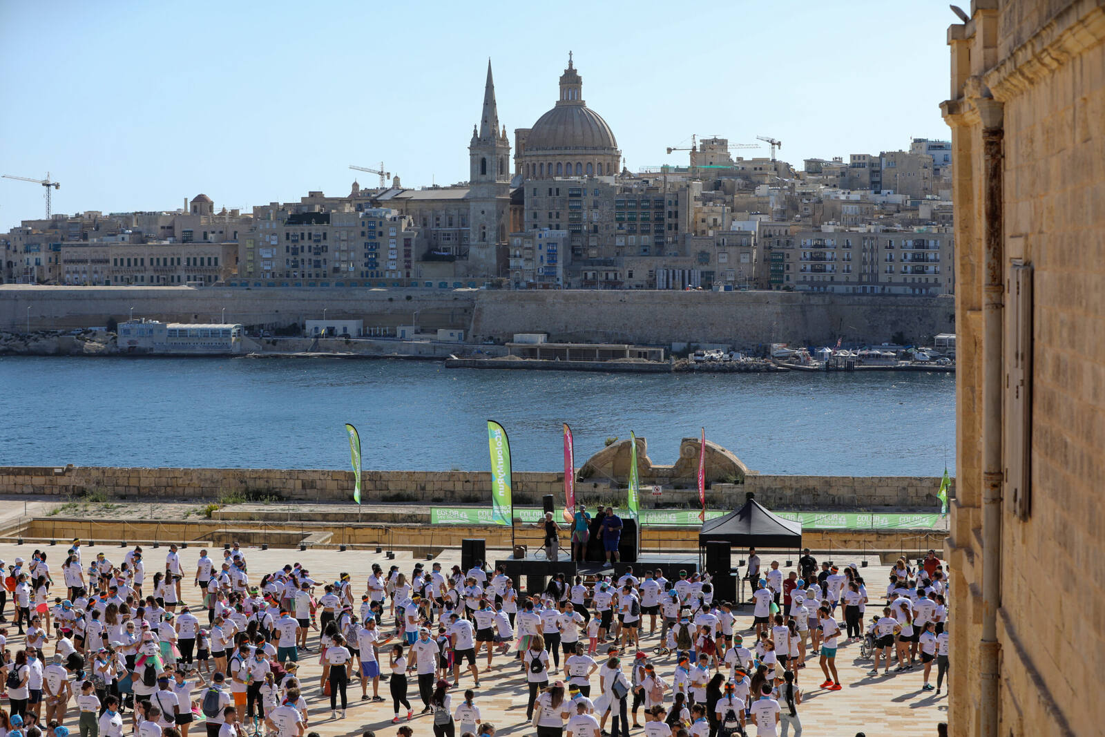 Start line crowd with the Valletta skyline